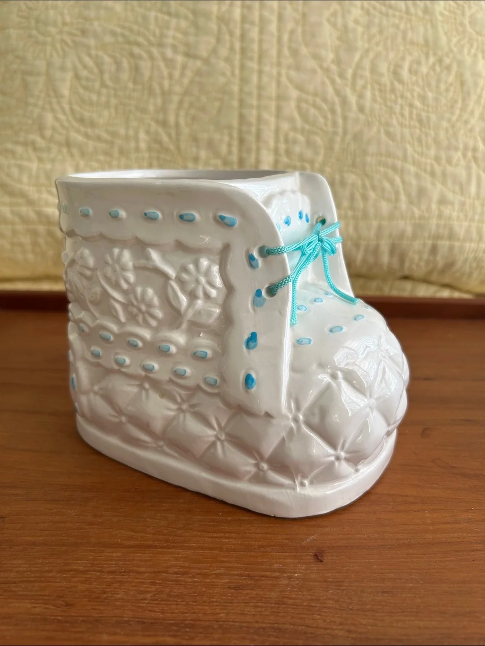 Vintage Ceramic baby bootie planter Embossed floral design and turquoise ribbon.
